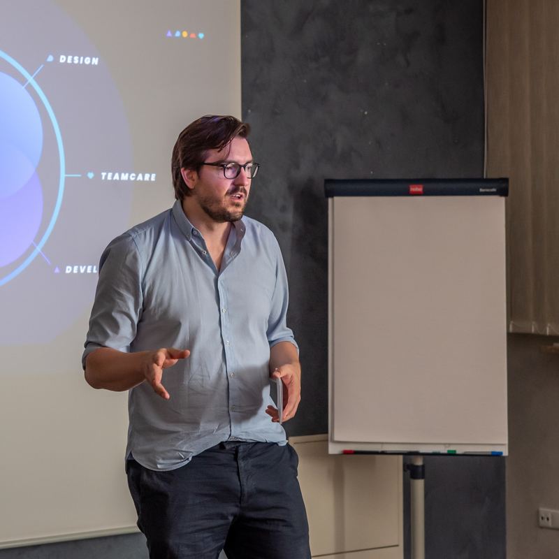 Christian Wenzel explaining something with both hands