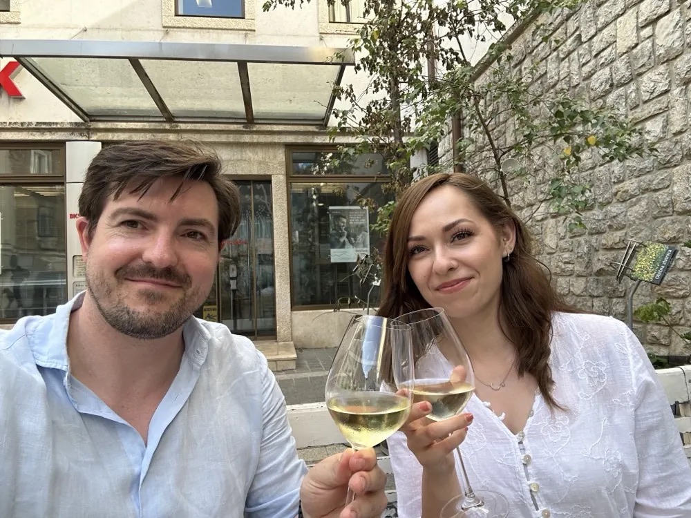 Christian Wenzel and his co-founder toasting with white wine