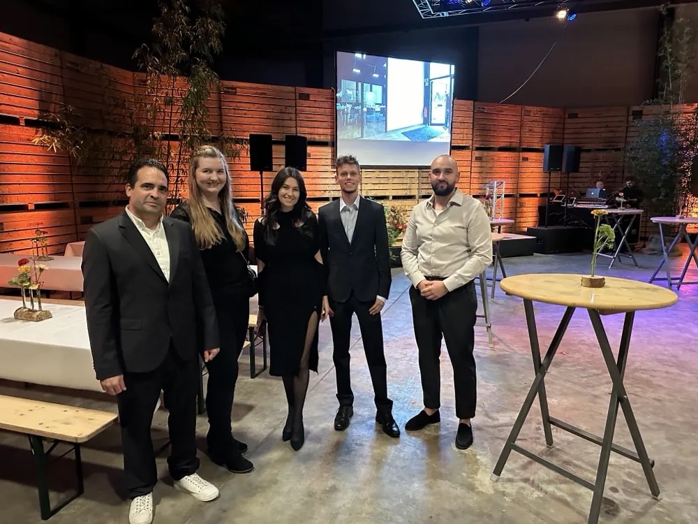Five people in front of the stage at the 130 years of Moerschen celebration