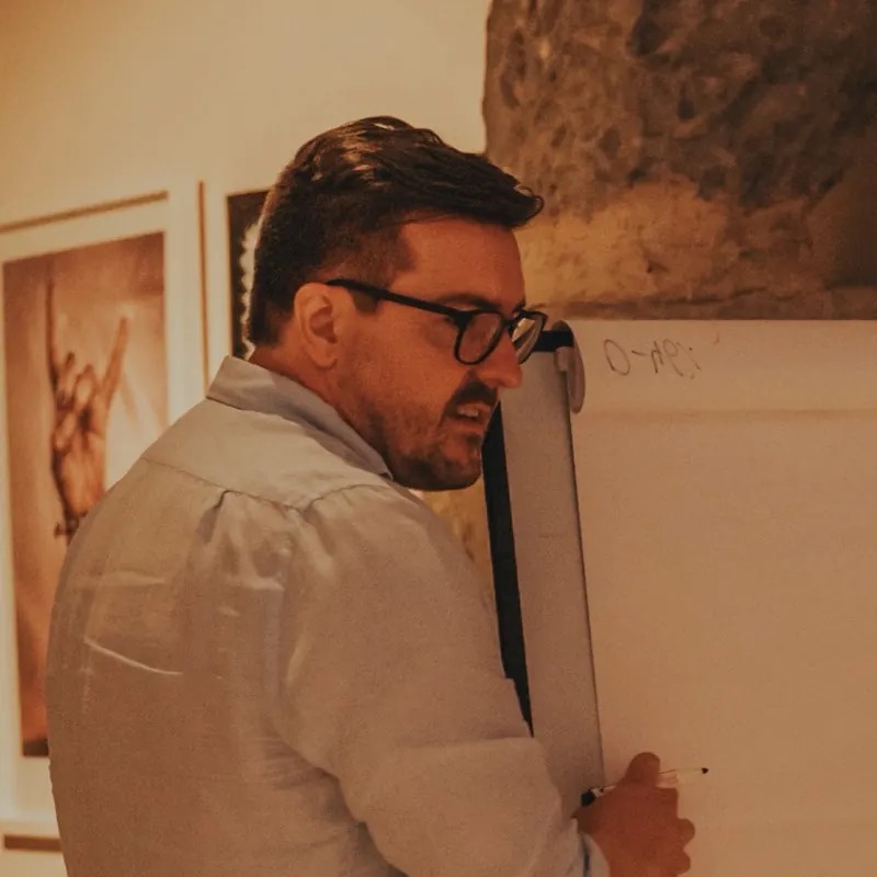 Christian Wenzel at a flipchart in a bright room